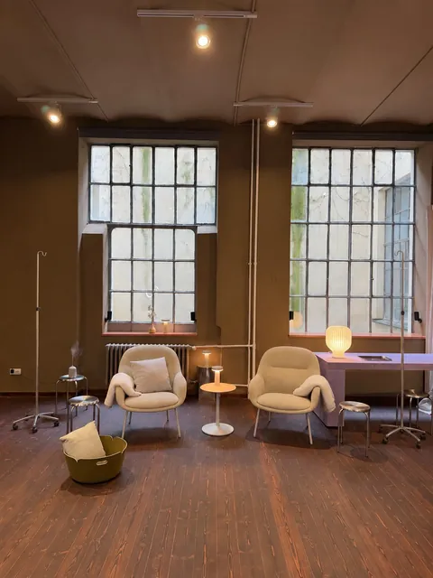 The treatment room with its tall factory windows